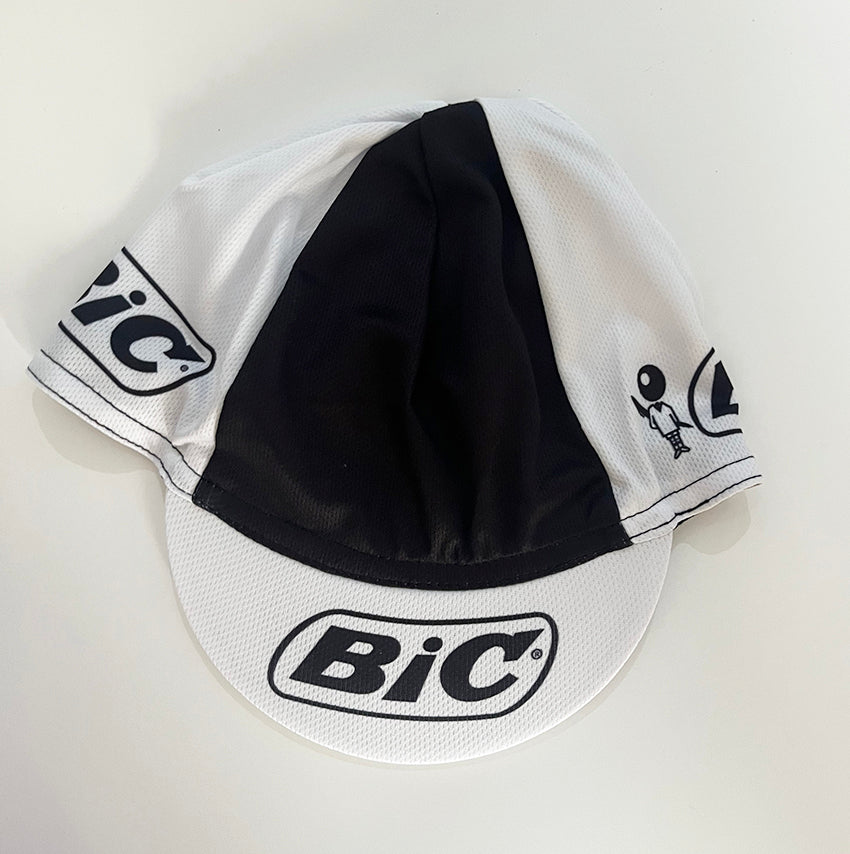 BIC retro cycling cap front view, white and black colorblock with BIC logo on brim