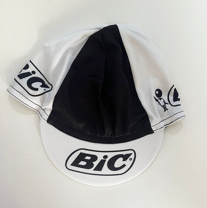 BIC retro cycling cap front view, white and black colorblock with BIC logo on brim