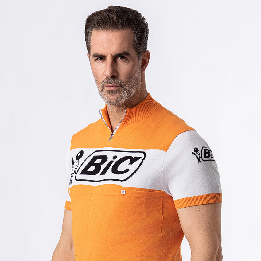 BIC retro cycling jersey side profile showing woven logo and ribbed sleeve cuff
