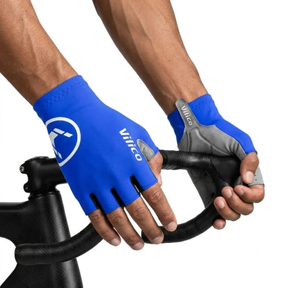 Blue half-finger cycling gloves worn while holding a road bicycle drop handlebar.