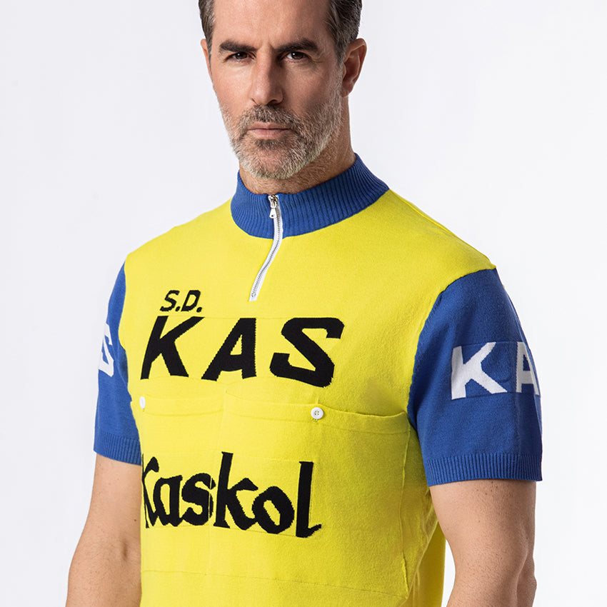 Close-up of KAS Kaskol retro cycling jersey showing woven logo, quarter-zip collar and blue sleeve