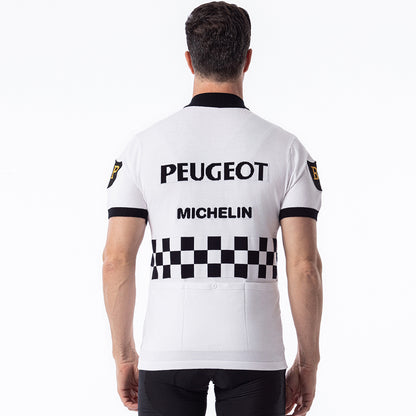 Man wearing Peugeot Michelin retro wool cycling jersey back view, white with black checkerboard